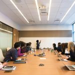 Business meeting with diverse team discussing projects in a modern conference room.
